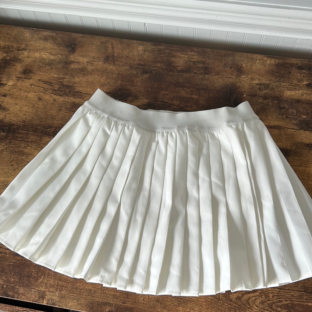 White pleated mini skirt